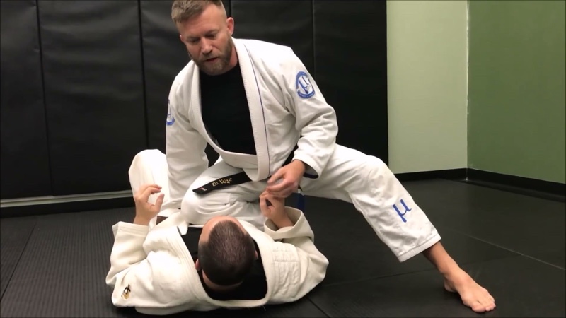 The top player plants one knee in the bottom player's torso with the other leg posted for base.